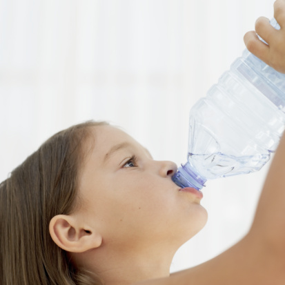 little girl drinking a water bottle