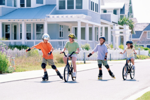 kids riding bikes and roller blading