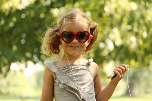 little girl with earphones