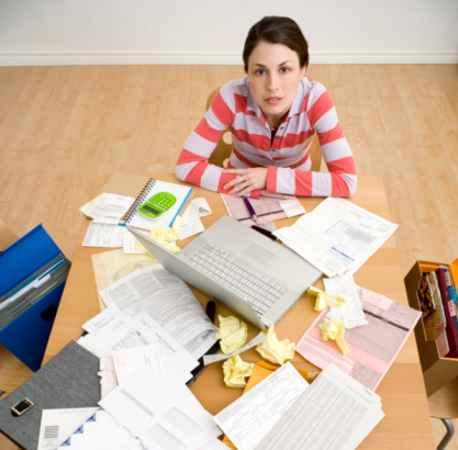 girl sitting with bills