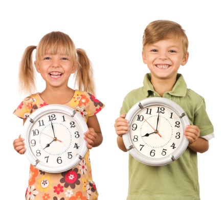 kids holding clocks