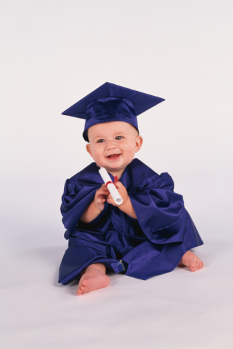 baby in cap and gown