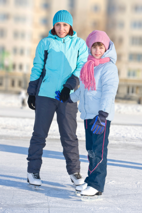 Mother with daughter at the skating rink