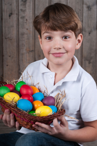 boy holding easter eggs