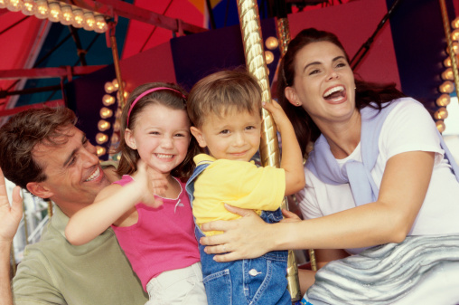 Family on a merry go round