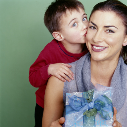 Son kissing mom on cheek