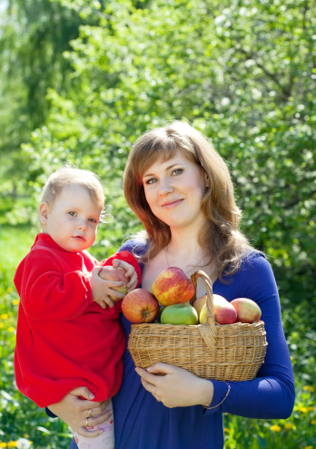 Mom picking apples