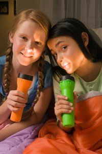 2 girls with flashlights