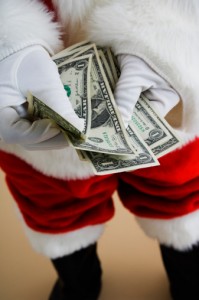 Santa Claus holding cash
