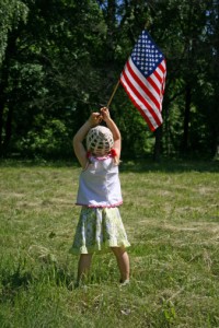 Girl holding an American Flag