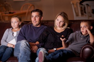 Family watching a movie